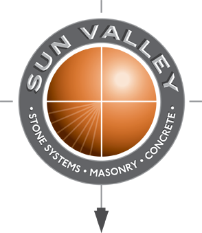 This is a logo featuring the words "sun valley" in bold letters at the top, with "stone systems," "masonry," and "concrete" written below. the graphic depicts a stylized.