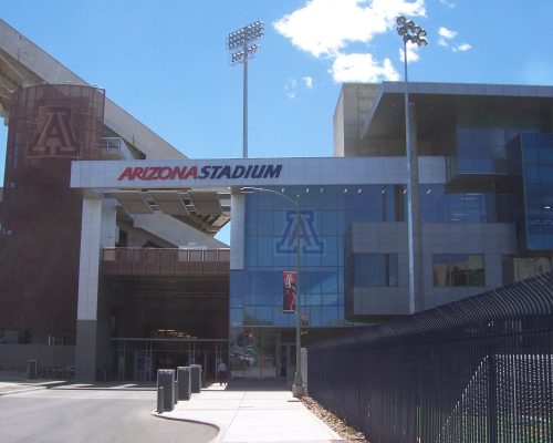 Exterior view of the arizona stadium under a clear blue sky.
